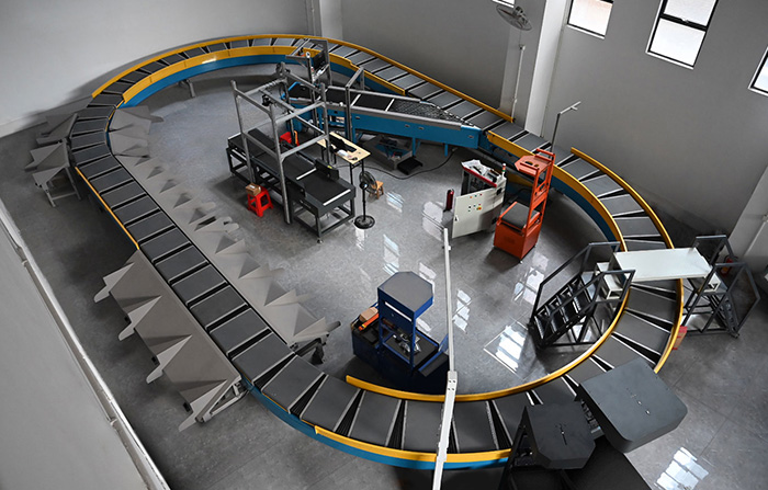 環型交叉帶分揀機的工作原理、特點及應用